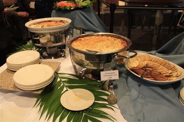 catering station with various food items and crackers