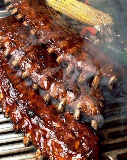 smoked baby back ribs on a grill