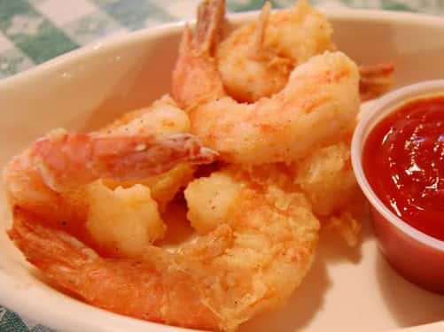 plate of fried shrimp with cocktail sauce