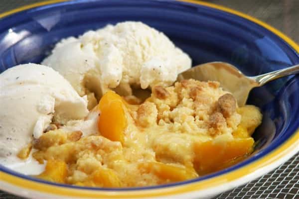pie on a plate with a scoop of ice cream