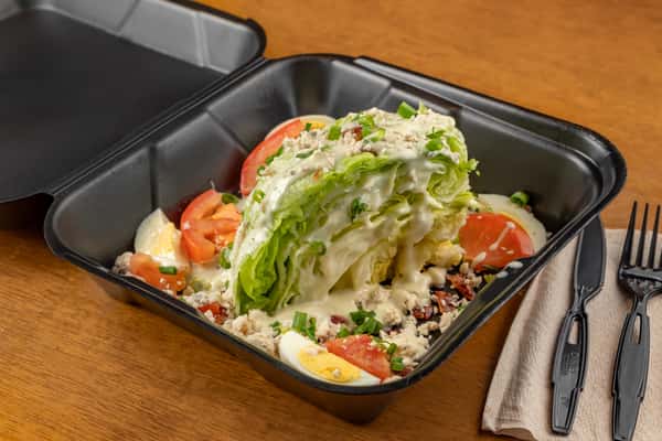 Iceberg Wedge, Tomatoes, Boiled Eggs, Bacon, Green Onions, Blue Cheese Crumbles and Dressing