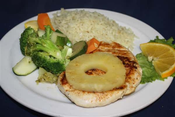grilled chicken with pineapple, and a side of rice and various vegetables