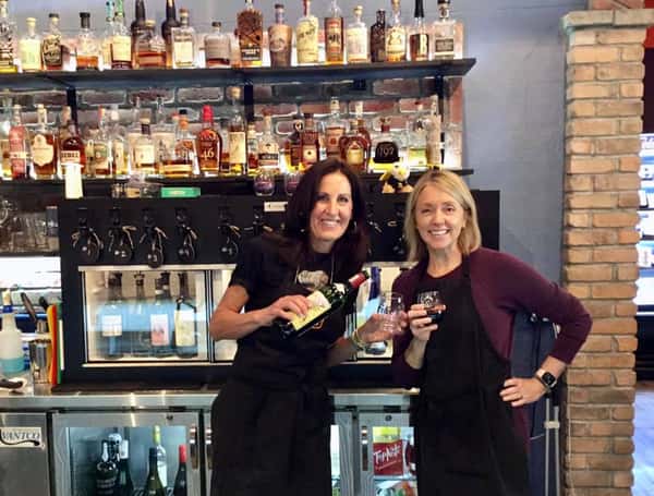 two employees posing for a photo