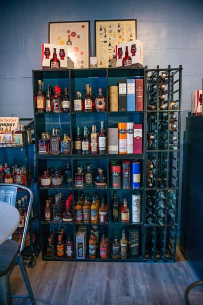 alcoholic bottles on a display shelf