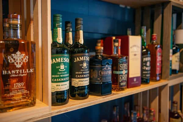 alcoholic bottles on a display shelf