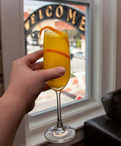 hand holding a mimosa