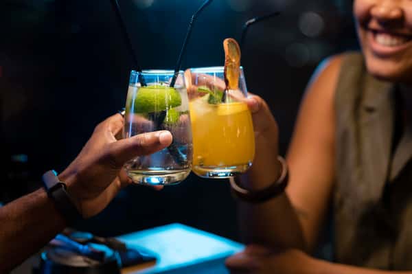 friends clinking drinks