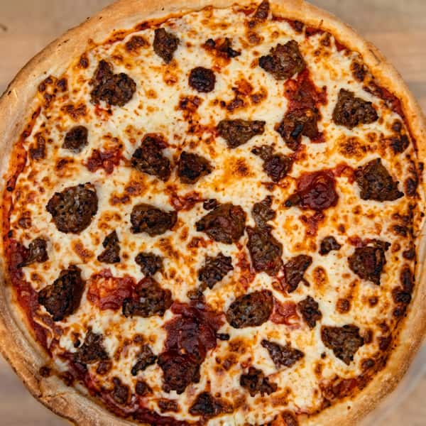Whole sausage pizza with melted white cheese and red sauce.