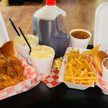 fries and meat with sides