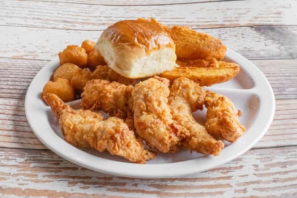 A plate of golden crispy chicken fingers served with a dipping sauce