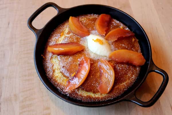 Pan de Elote, a sweet corn bread slice with rich texture, a house-baked treat at Zaranda Houston