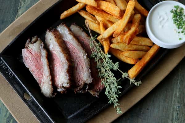 Picanha grilled beef cut with seasoning and sides, a premium meat dish at Zaranda Houston