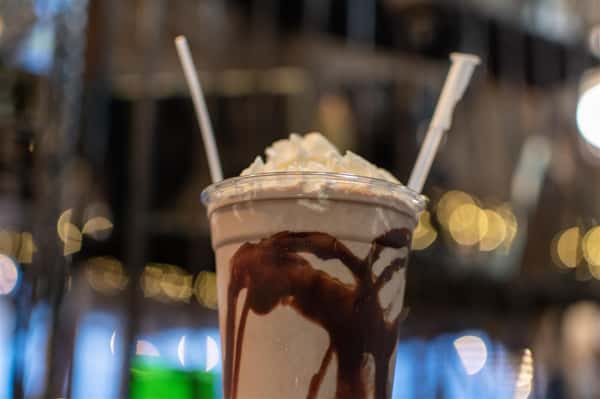 peanutbutter milkshake with choclate syrup and topped with whipped cream