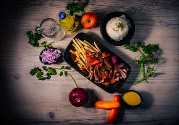 stir-fry steak with white rice and french fries