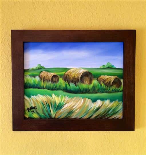 Local Art with hay bales on a field