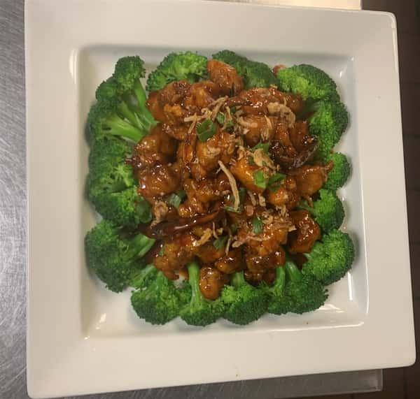 sweet and sour chicken on a bed of broccoli