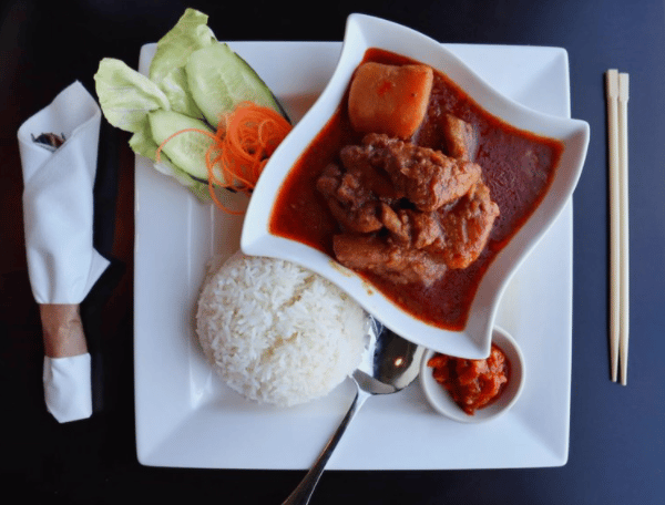 chicken curry with a side of rice