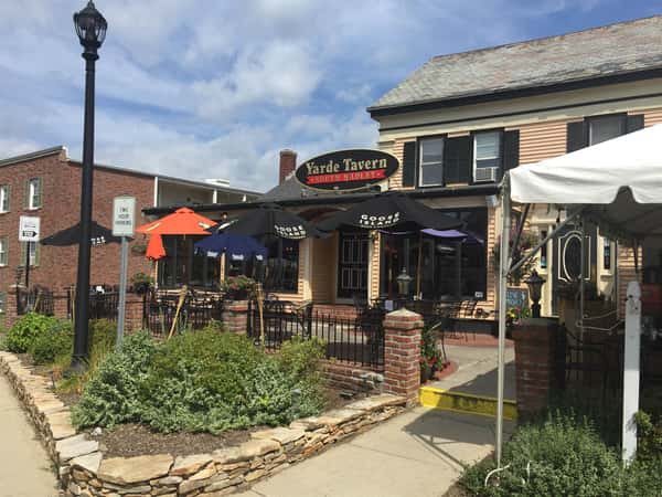 exterior gated entrance to the yarde tavern with an outdoor patio