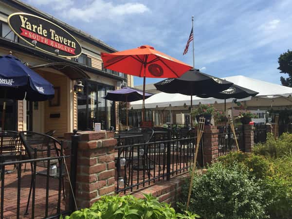 exterior gated entrance to the yarde tavern with an outdoor patio