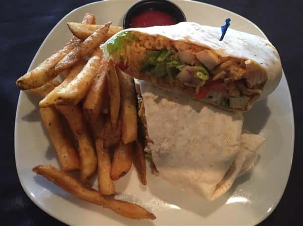 grilled chicken wrap with lettuce, tomatoes and a side of fries