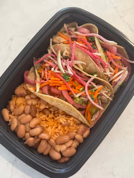 Two Step Taqueria Plato with tacos, red rice, mayocoba beans and pickled vegetables