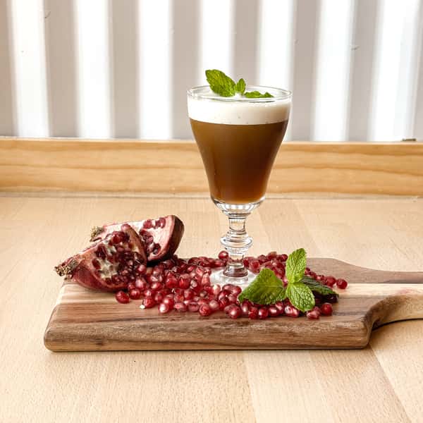 frothy coffee with garnish