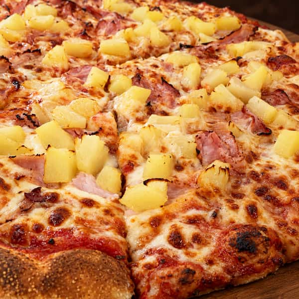 Authentic pizza on a warm wooden board