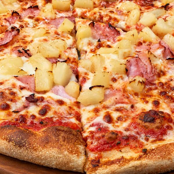 Appetizing pizza on a warm wooden board