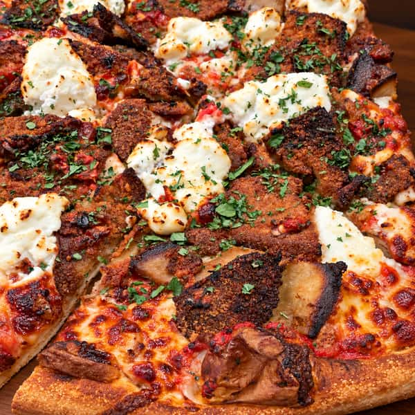 Authentic pizza on a warm wooden board