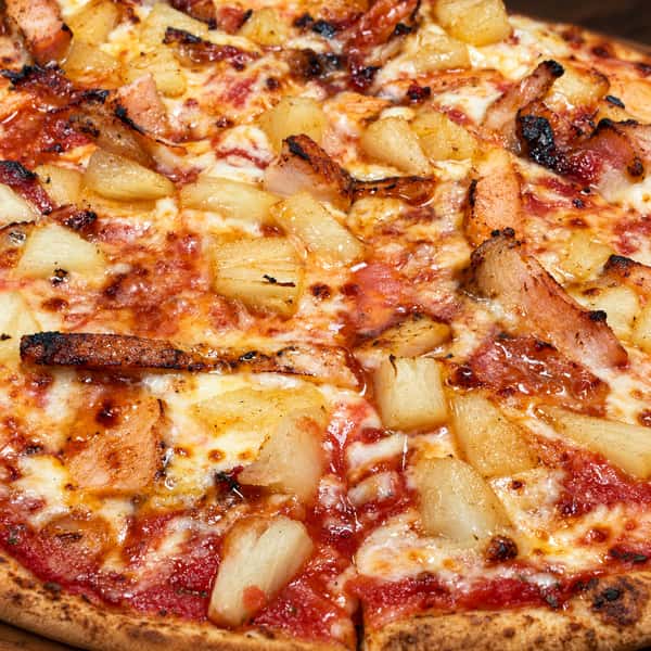 Authentic pizza on a warm wooden board
