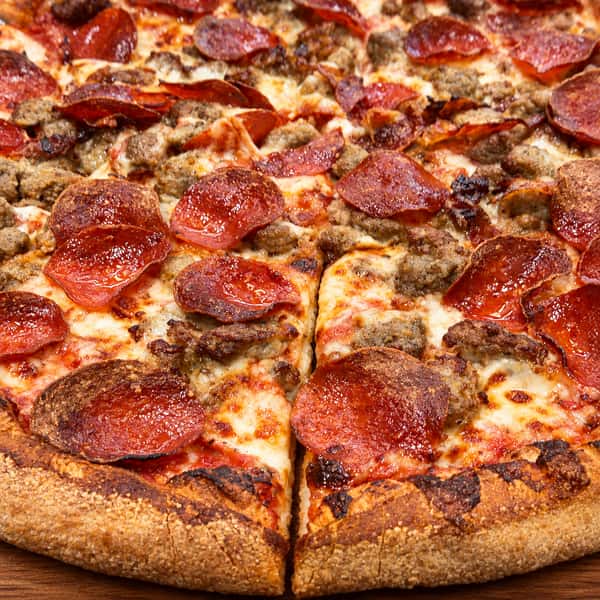 Pizza on a warm wooden board