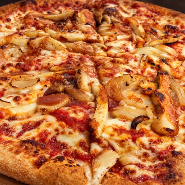 Appetizing pizza on a wooden board