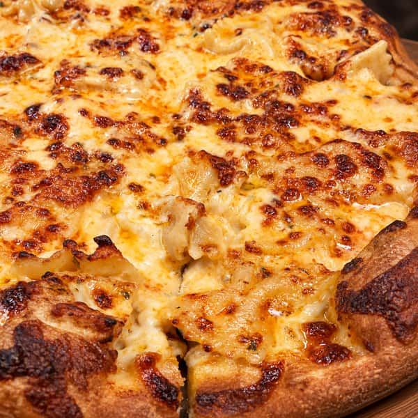 Authentic pizza on a wooden board