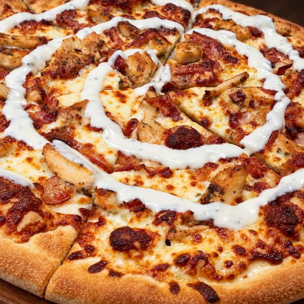 Close-up pizza on a wooden board