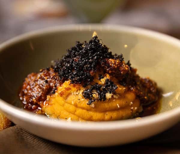 Baked Hummus with black ants