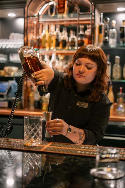 Bartender building a cocktail