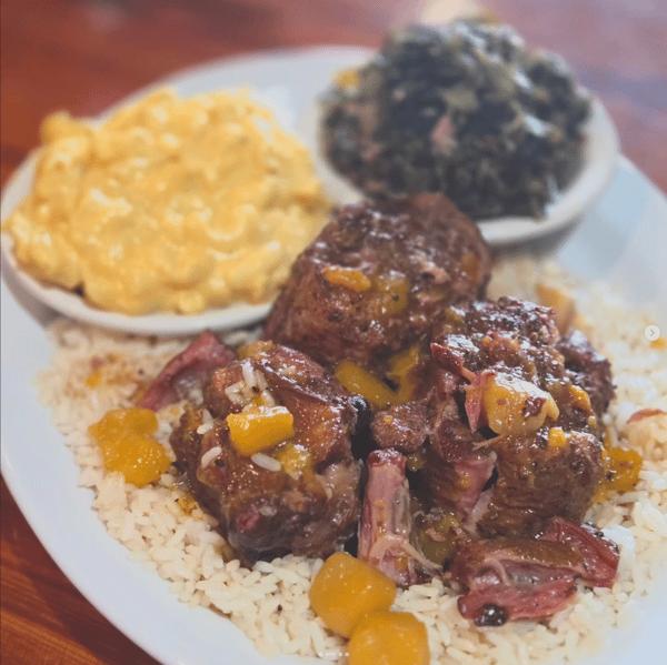 Smoked Ox Tails over Coconut Rice Served with Collard Greens & Mac & Cheese