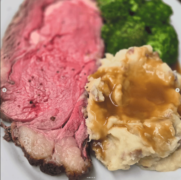 12 Oz. Smoked Prime Rib Served With Mashed Potatoes over Brown Gravy & Broccoli.