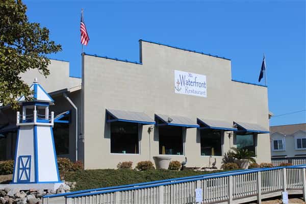 exterior side of the waterfront restaurant showcasing the windows