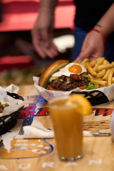 server placing down plate of food on table
