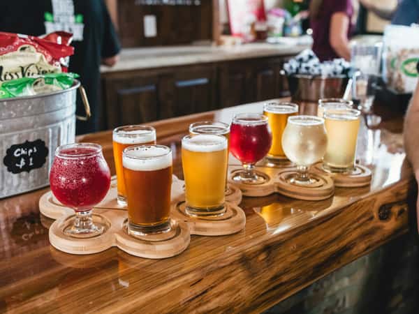 Cocktails and colorful drinks on a wooden bar tabke