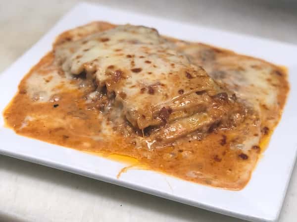 Lasagna with melted cheese on a plate