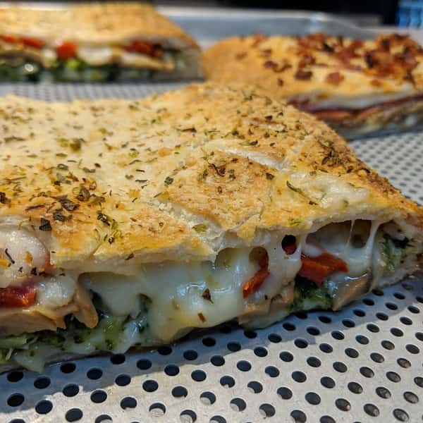 stuffed pizza with cheese and vegetables