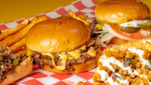double cheeseburger with crispy edges, melted cheese, and sauce on a soft brioche bun