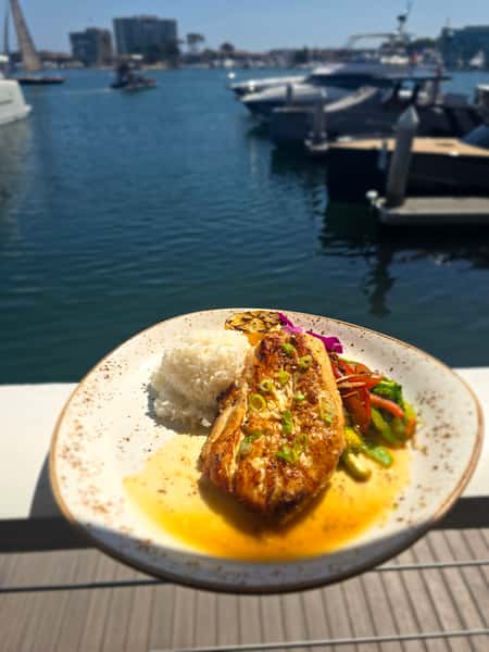 plate of food outside by the water