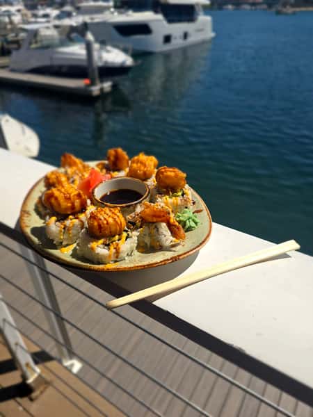 plate of food outside by the water