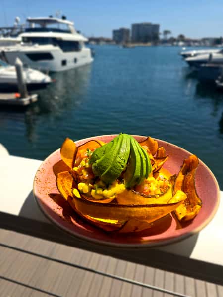 plate of food outside by the water