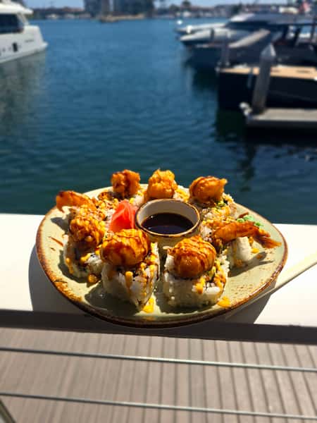 plate of food outside by the water