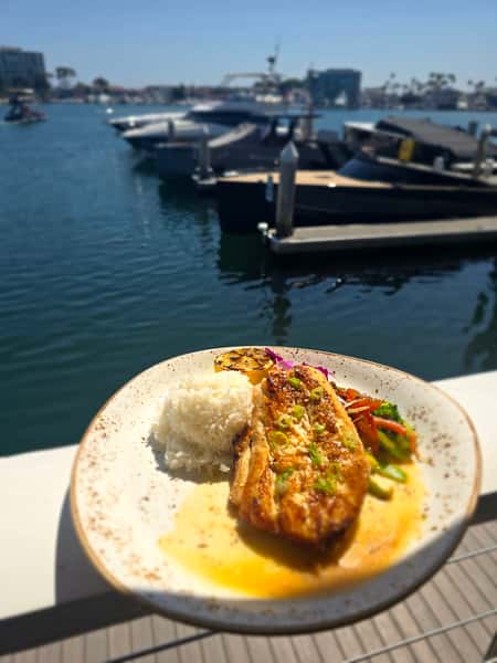 plate of food outside by the water