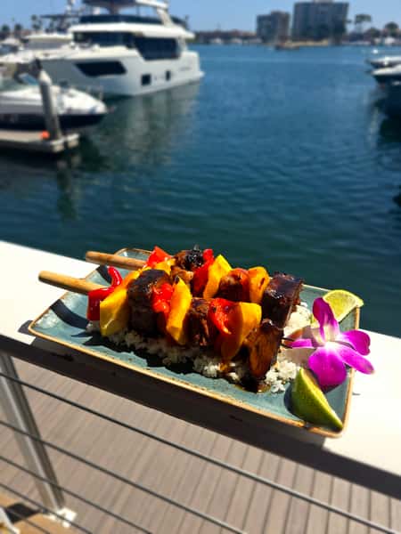 plate of food outside by the water